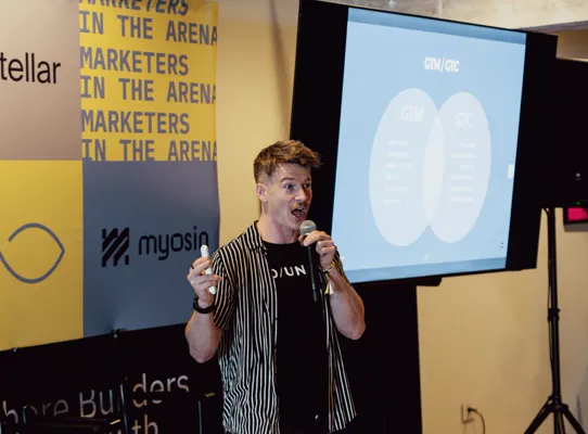 Dan on stage mid-talk